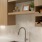 Beige Elm Cabinets with White Quartz Countertops and Hexagon Tile Backsplash